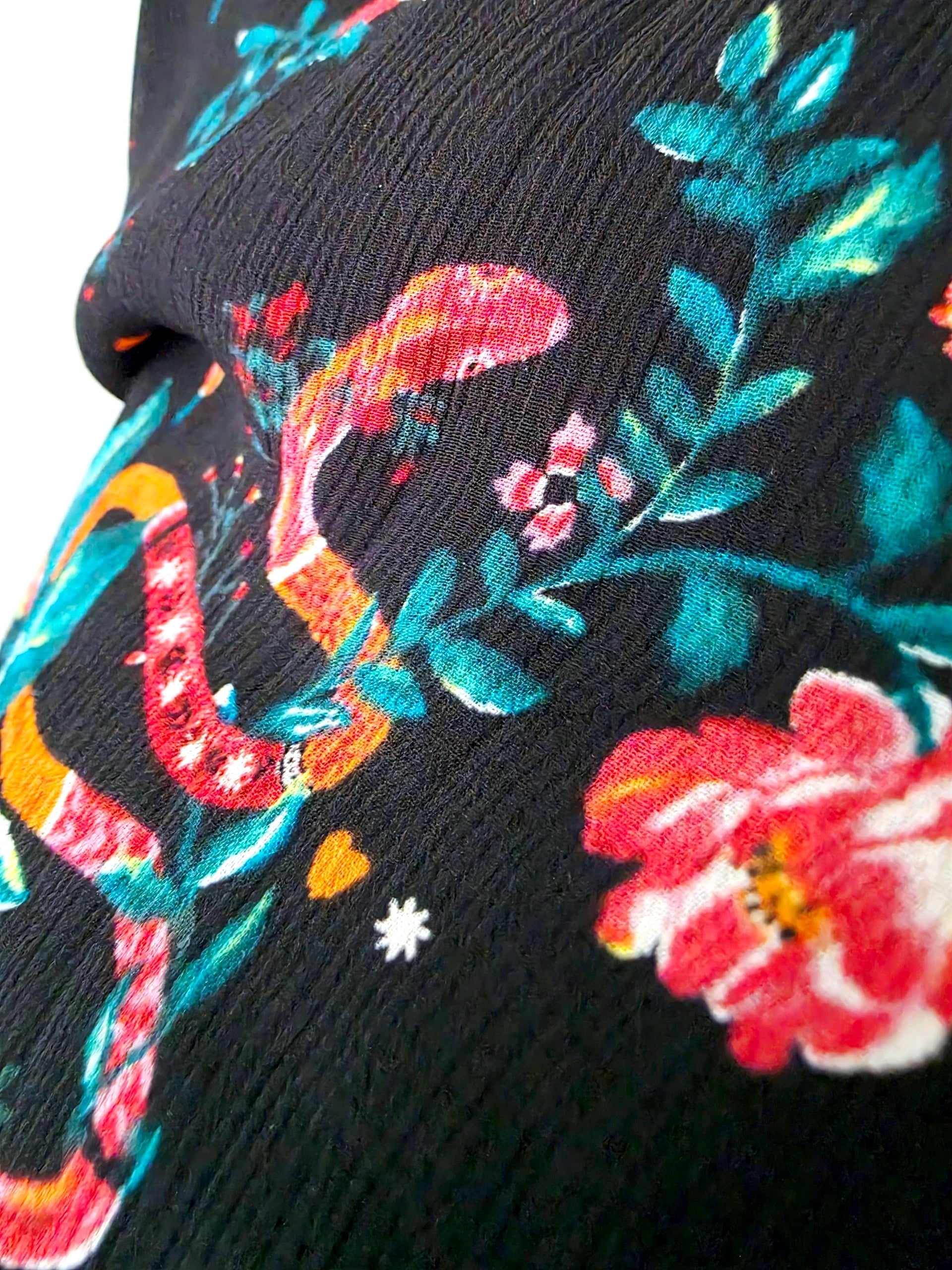 Jupe asymétrique noire à imprimé fleuri
