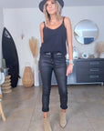 Pantalon slim noir huilé