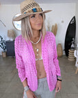 Veste rose ajourée