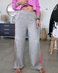 Pantalon taupe à bandes fluo