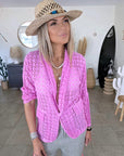 Veste rose ajourée