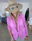 Veste rose ajourée