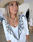 Cardigan blanc à encolure en V profonde