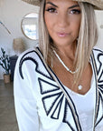 Cardigan blanc à encolure en V profonde