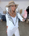 Cardigan blanc à encolure en V profonde