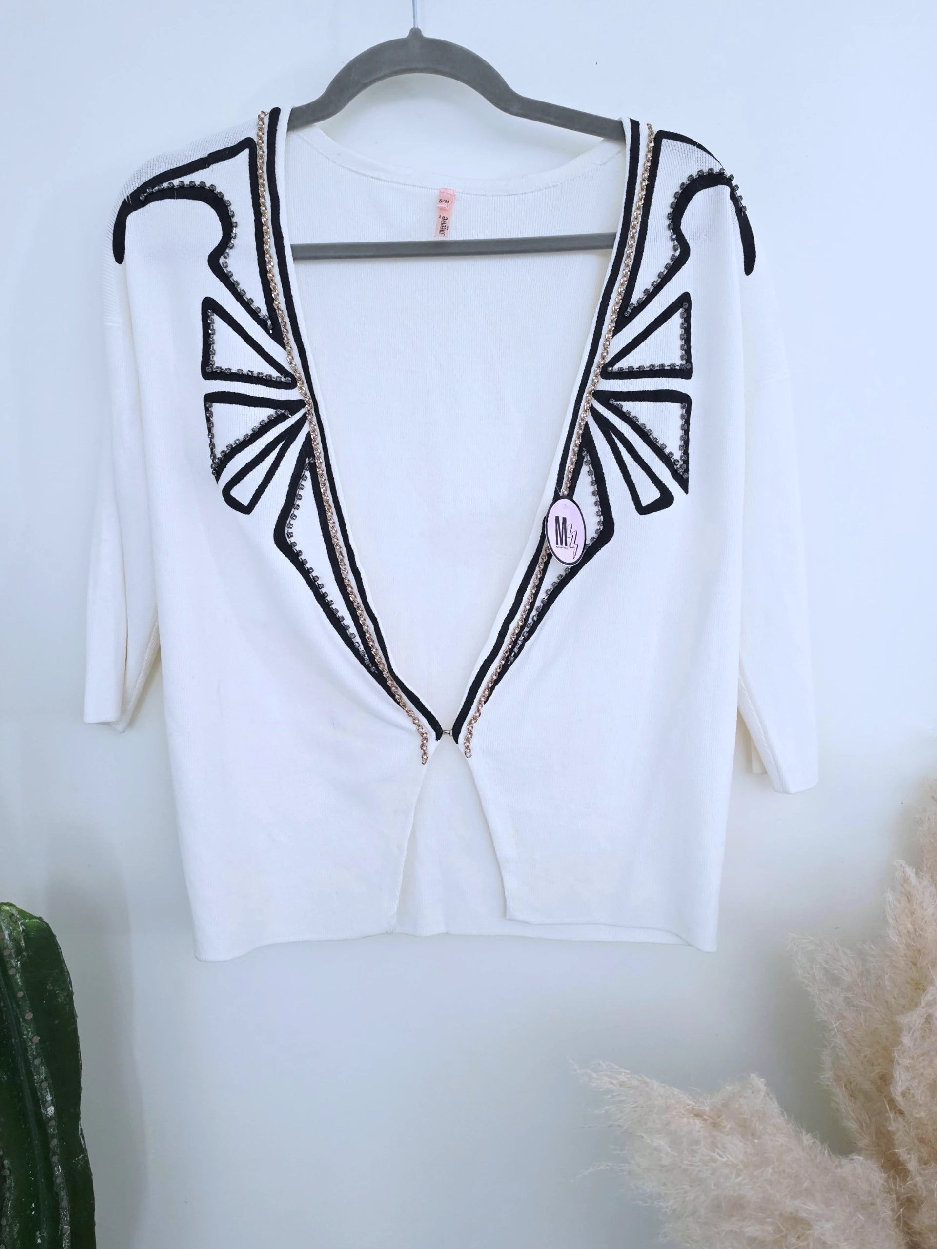 Cardigan blanc à encolure en V profonde
