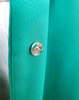 Veste cintrée verte avec pins éclair