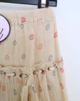 Jupe beige à volants