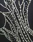 T-shirt noir muni de perles bijoux