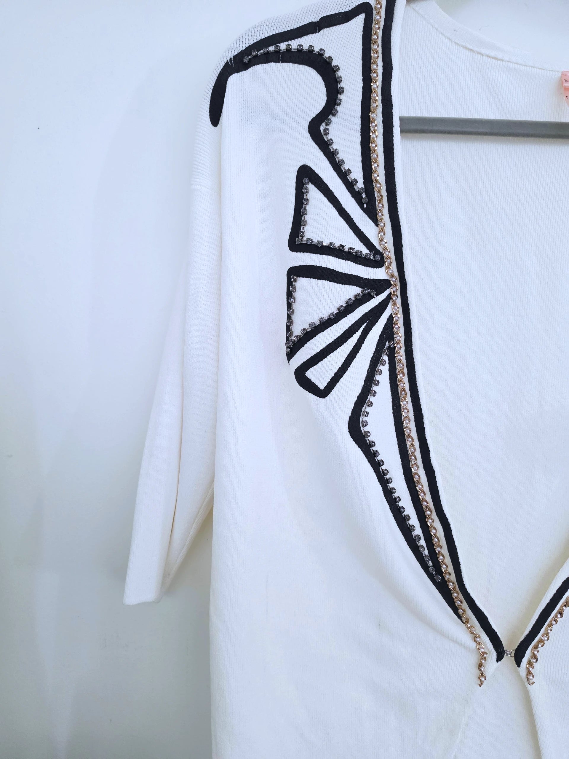 Cardigan blanc à encolure en V profonde