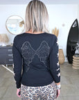 Pull noir à maille fine dos à strass
