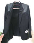 Blazer noir à épaulettes en cuir et clouté