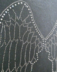 Pull noir à maille fine dos à strass