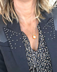 Blazer noir à épaulettes en cuir et clouté