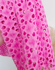 Veste rose ajourée