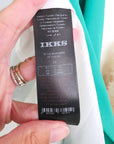 Veste cintrée verte avec pins éclair