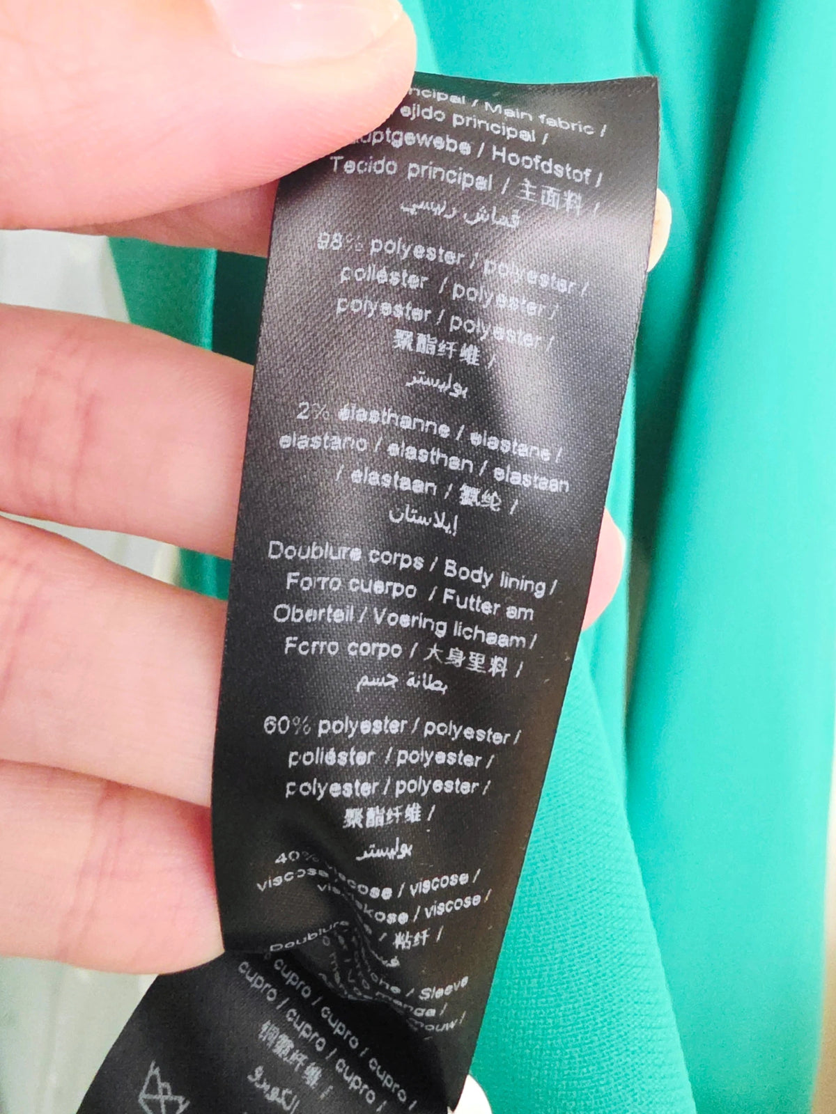 Veste cintrée verte avec pins éclair