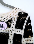 Pull ajouré noir et écru