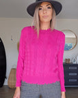 Pull torsadé fuchsia
