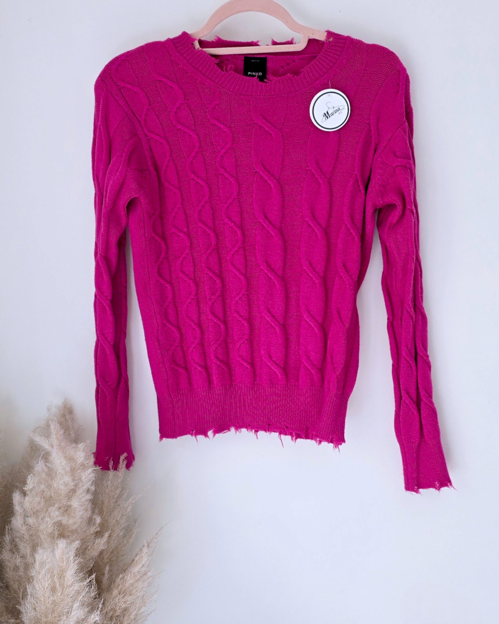 Pull torsadé fuchsia