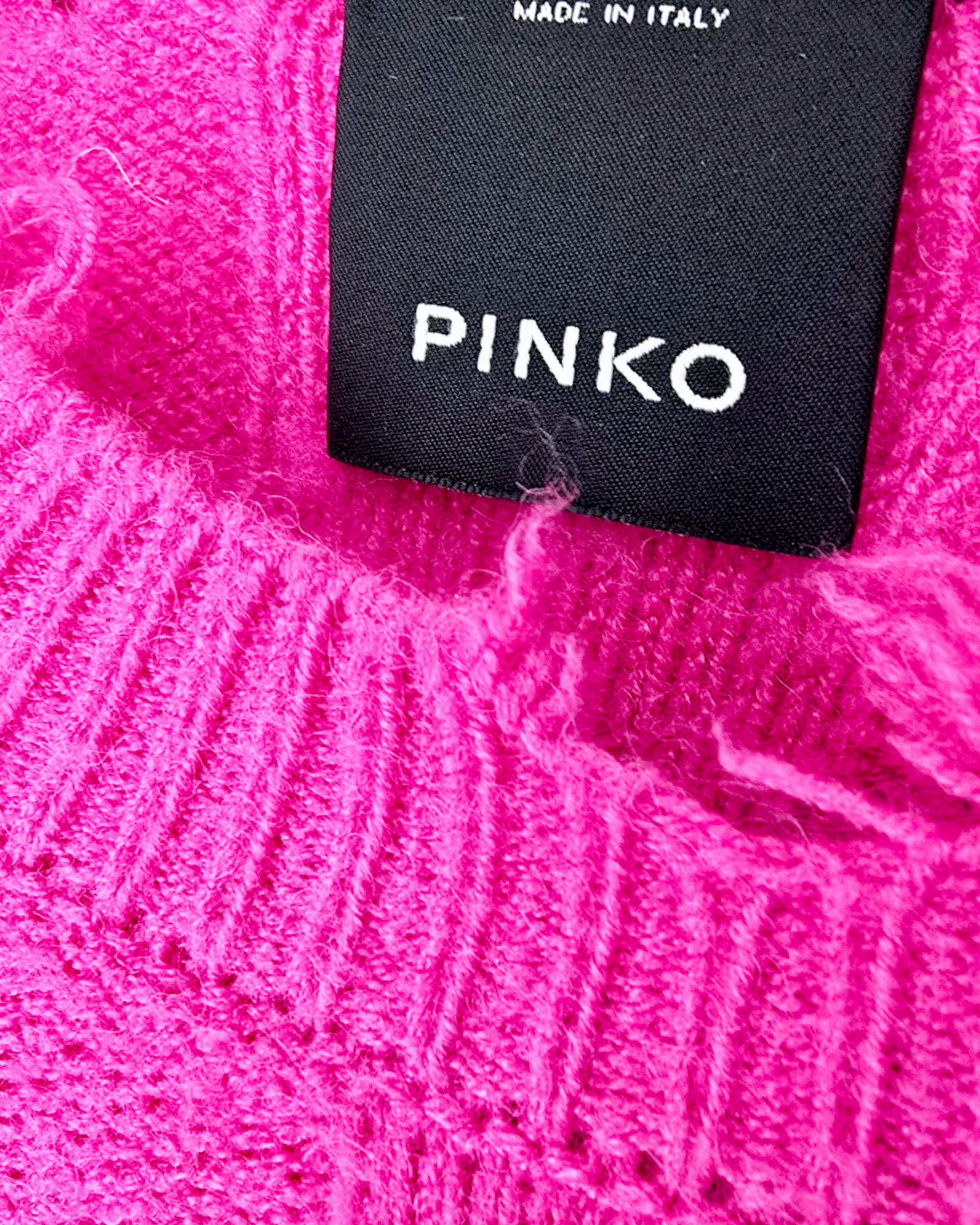 Pull torsadé fuchsia