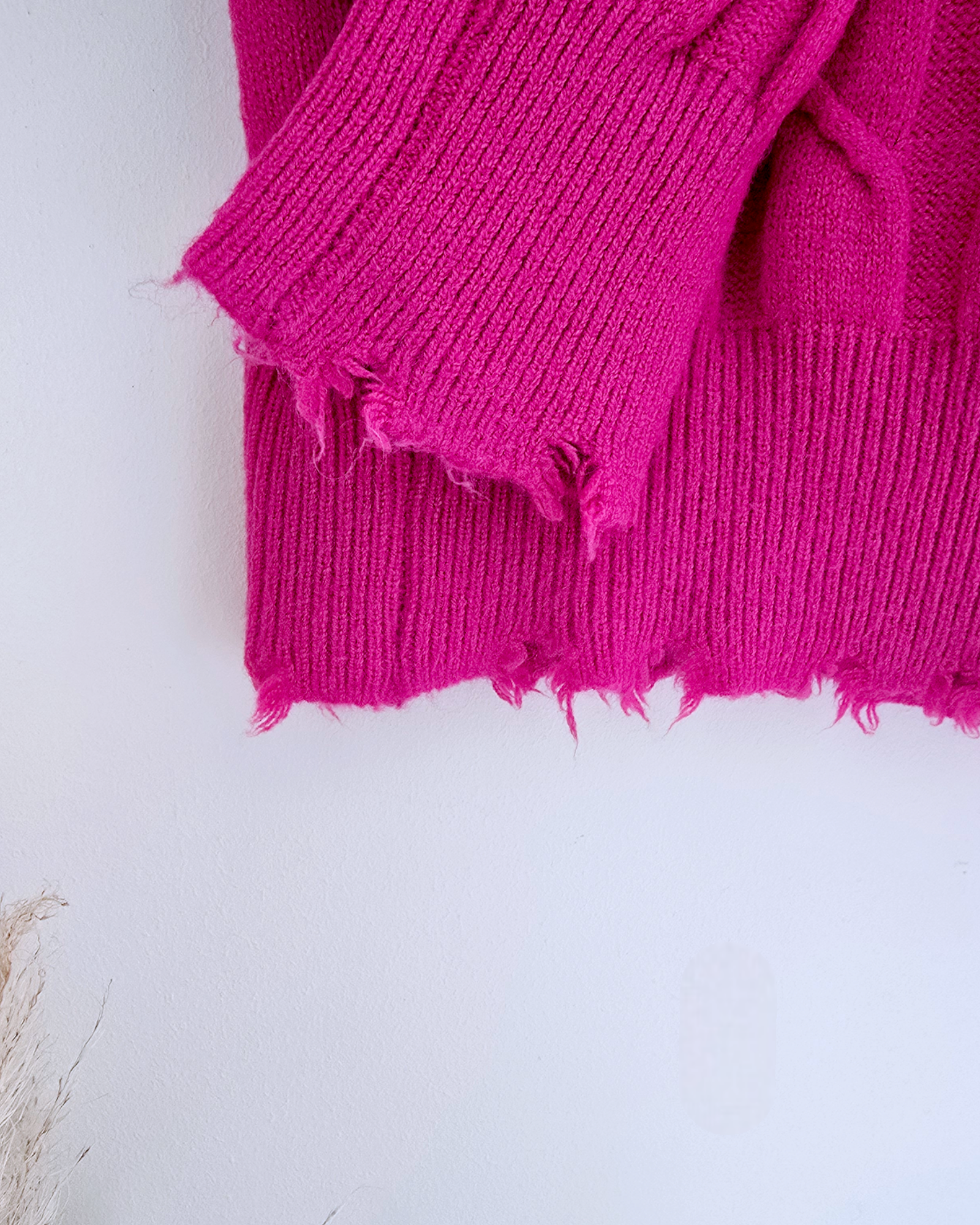 Pull torsadé fuchsia