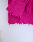 Pull torsadé fuchsia