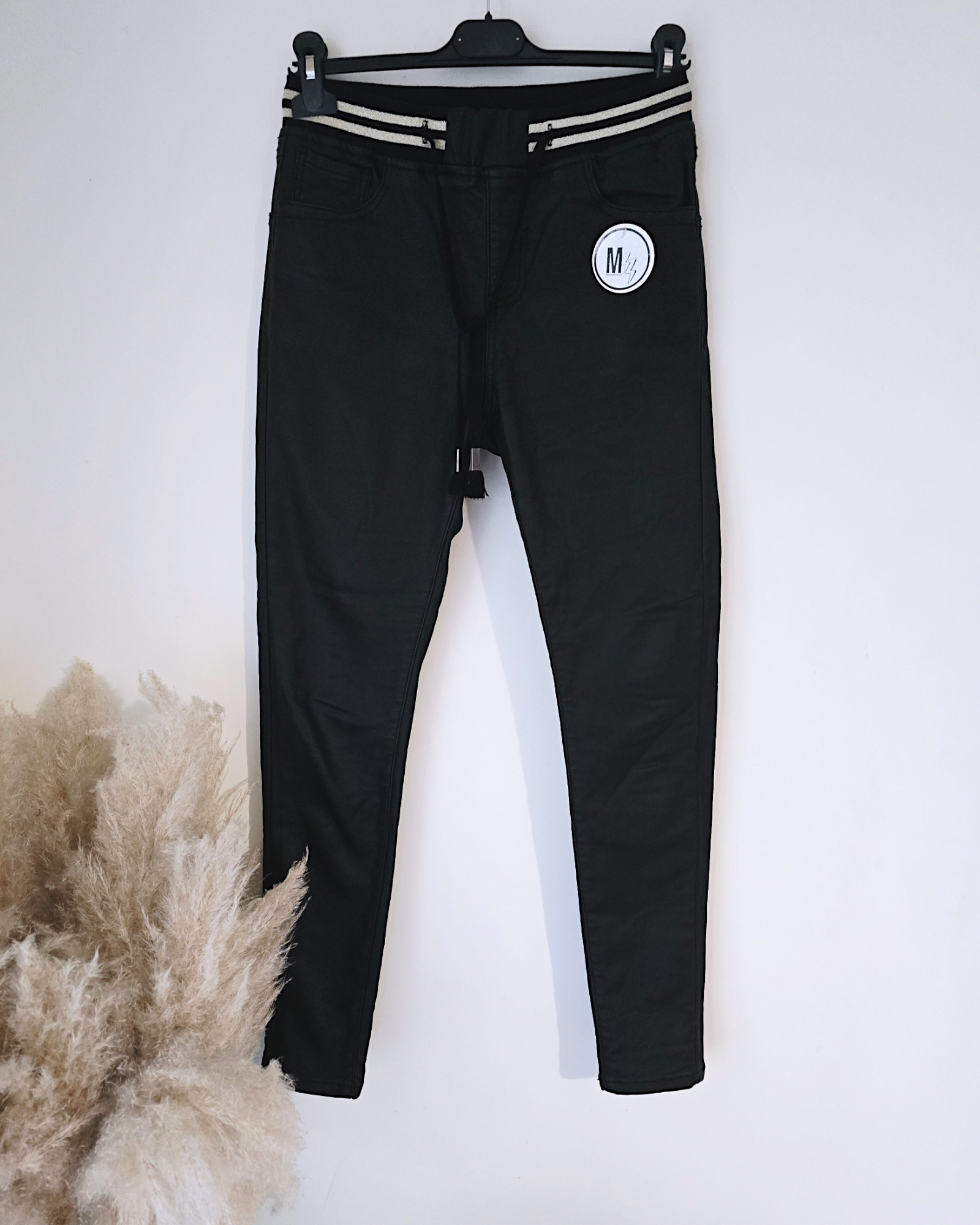 Pantalon slim noir huilé