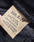 Pantalon slim noir huilé