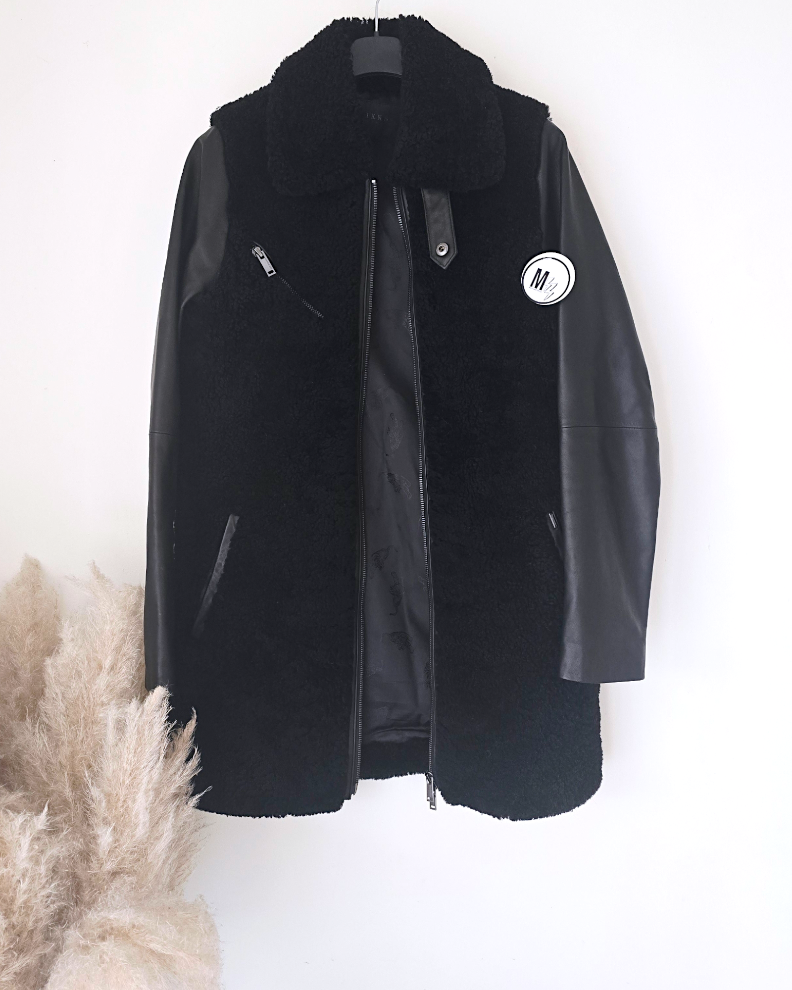 Manteau teddy noir manches cuir et peau retournée