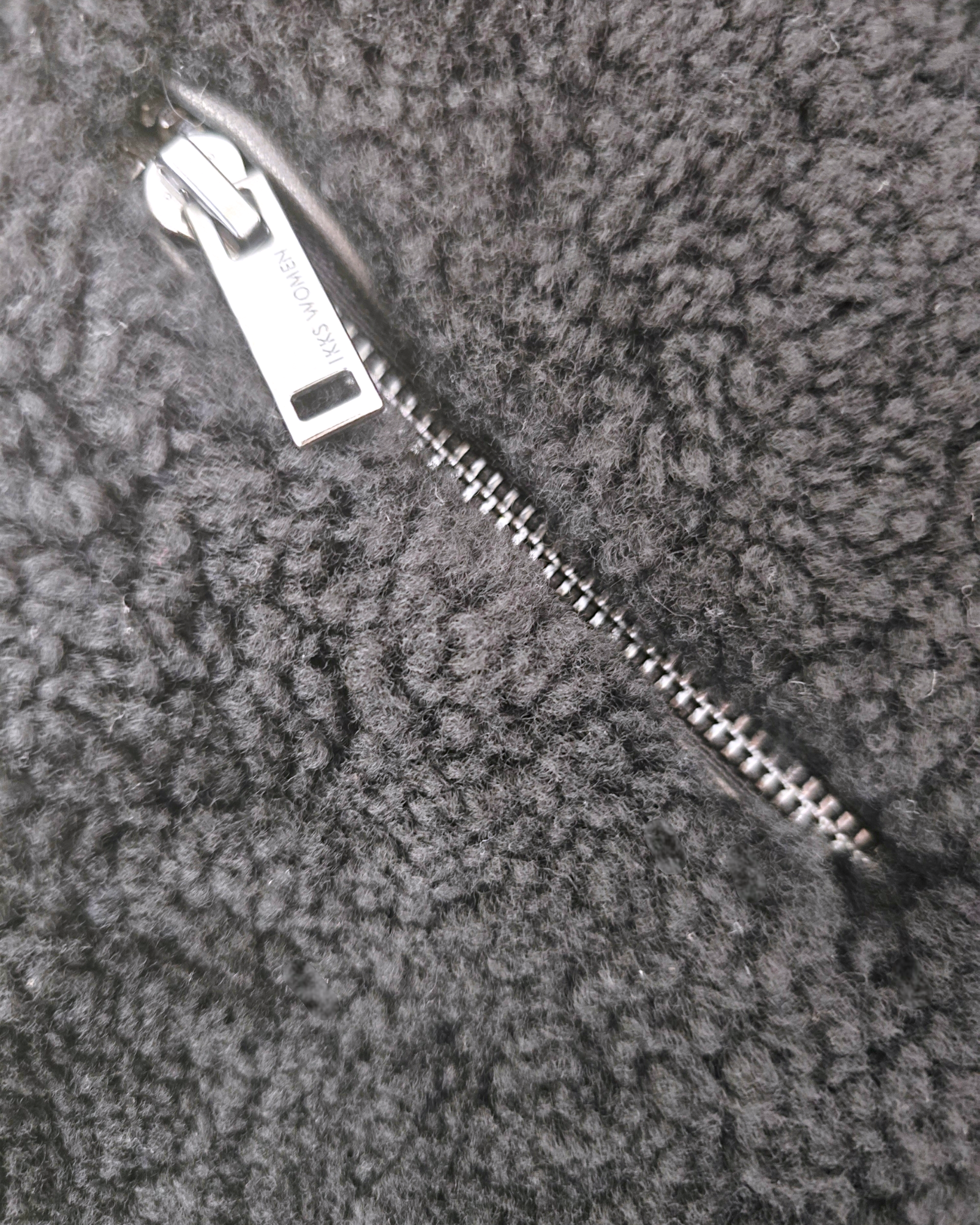 Manteau teddy noir manches cuir et peau retournée