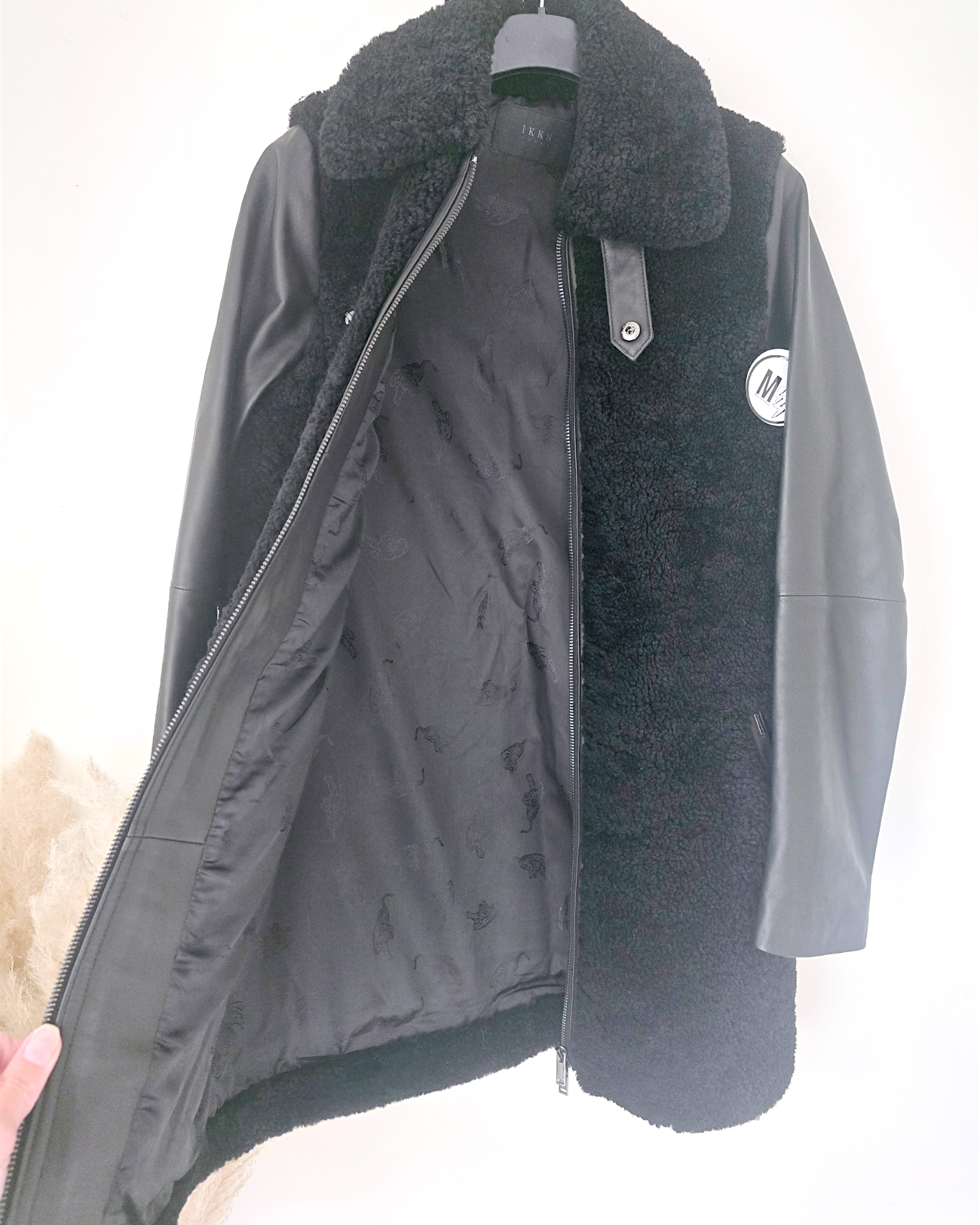 Manteau teddy noir manches cuir et peau retournée