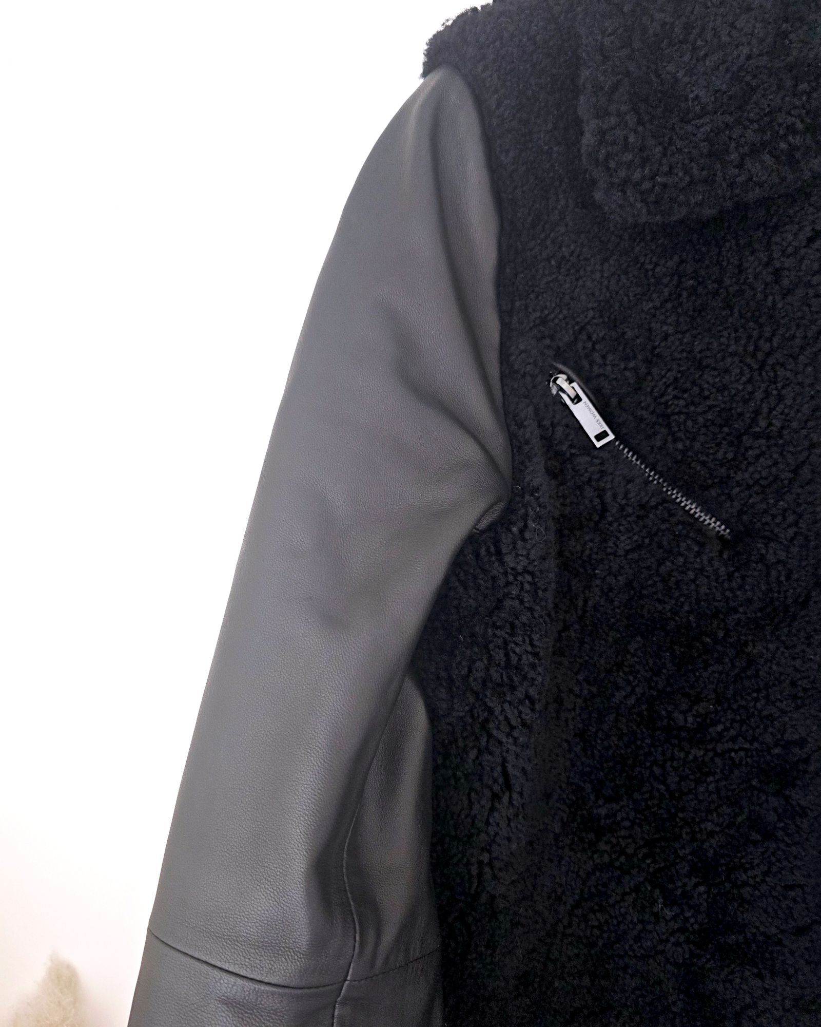 Manteau teddy noir manches cuir et peau retournée