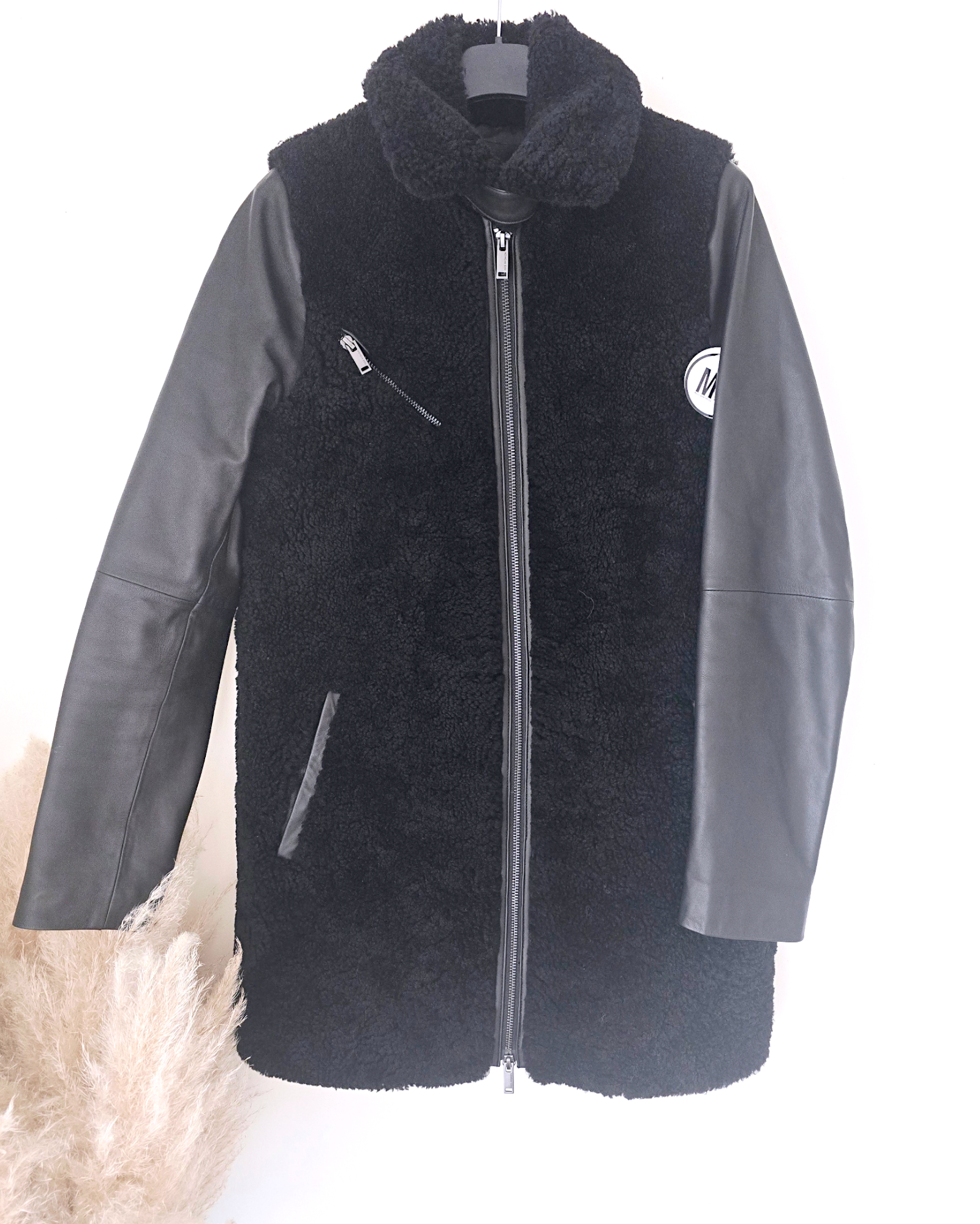 Manteau teddy noir manches cuir et peau retournée