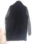 Manteau teddy noir manches cuir et peau retournée