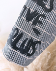 Veste boy à carreaux et tags