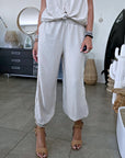 Ensemble beige haut + pantalon à bandes latérales