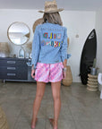 Veste en jean à inscriptions en perles