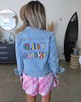 Veste en jean à inscriptions en perles