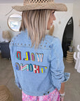 Veste en jean à inscriptions en perles