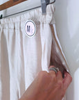 Ensemble beige haut + pantalon à bandes latérales