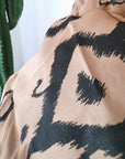 Jupe beige à imprimé noir