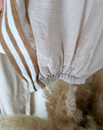Ensemble beige haut + pantalon à bandes latérales
