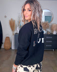 Pull noir à inscriptions au dos - 𝐌𝐚𝐫𝐢𝐧𝐚𝟒𝟒𝐟𝐚𝐦𝐢𝐥𝐲